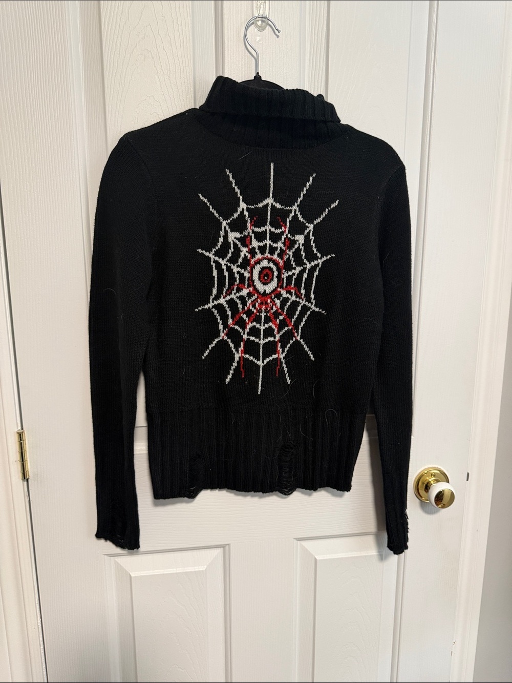Black Turtleneck Sweater with Spiderweb Intarsia